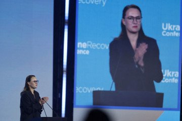 Ukraine's Prime Minister Yulia Svyrydenko is displayed on a screen as she addresses participants of the Ukraine Recovery Conference (URC 2026) in Gdansk, Poland, on June 25, 2026. (Source: Getty Images)