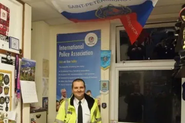 Police memorabilia, including a St. Petersburg-emblazoned flag, in former British police officer Mark Bullen’s Hertfordshire office. (Source: Social media)