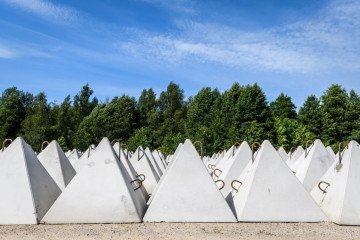Dragon’s teeth fortifications, pyramidal anti-tank obstacles, are seen during a press tour to present military reinforcement measures near the border of Latvia with Russia. (Source: Getty Images) Dragon’s teeth fortifications, pyramidal anti-tank obstacles, are seen during a press tour to present military reinforcement measures near the border of Latvia with Russia. (Source: Getty Images)