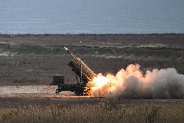 A Patriot rocket launcher of the Romanian army fires a PAC-2 ATM missile during an army drill at the Capu Midia military shooting range next to the Black Sea, November 15, 2023. (Source: Getty Images)