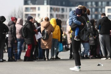 Lithuania Plans €12 Million Allocation to Support Ukrainian Refugees People fleeing from Ukraine wait in a line outside Tauron Arena sports hall where registration point for National Identification Number is opened. (Source: Getty Images)