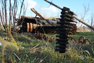 A destroyed Russian tank on a road near Izyum, eastern Ukraine, on October 7, 2022. (Source: Getty Images)