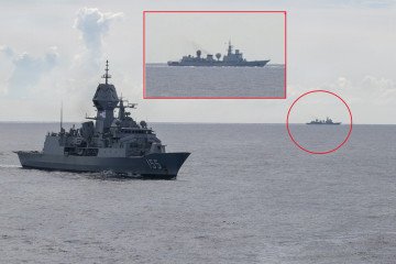 Royal Australian Navy’s HMAS Ballarat sails near a Chinese Type 815 Dongdiao-class surveillance ship during joint drills. (Source: Cyrus Roson)