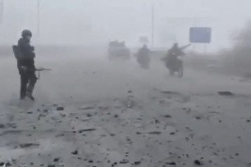 Russian soldiers enter the embattled town of Pokrovsk, Ukraine, in this screen grab obtained from a social media video released on November 10, 2025. (Source: Social Media/via REUTERS)