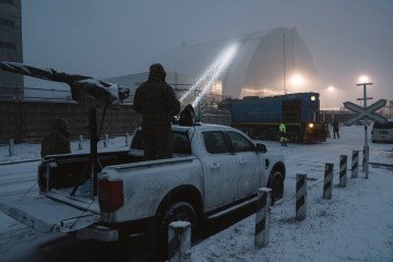 Inspection of damage to Reactor 4 containment at the Chernobyl nuclear power plant following a Russian drone strike. (Source: Getty Images)