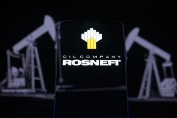 The Rosneft Oil Company logo is displayed on a smartphone screen in this photo illustration. (Source: Getty Images)