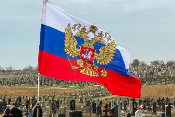 Russian flag waving over an orthodox cemetery. (Source: Getty Images)