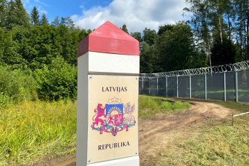 A border pillar with the inscription "Republic of Latvia" stands on the Latvian border with Russia. (Source: Getty Images)