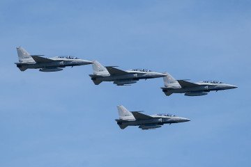 Polish Air Force KAI FA-50 fighter jets fly in formation over the city during the Polish Armed Forces Day military parade in Warsaw, Poland on 15 August 2026. (Source: Getty Images)