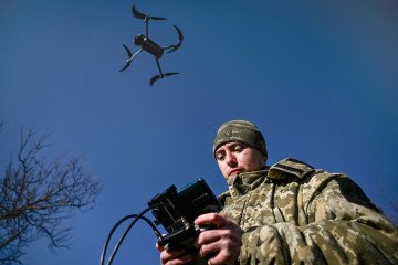 A Ukrainian serviceman sharpens his drone-flying skills during a training session.