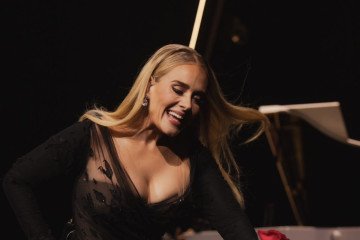 Adele Seen Wearing a Dress by a Russian Designer Who Also Designs Military Uniforms for Russia’s Army