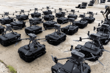 Rows of quadcopter drones are displayed with their transport cases before deployment during a demonstration of unmanned aerial systems in Ukraine. (Photo: open source)