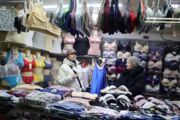 Elderly sellers chat near the counter with underwear inside the clothing shop in the underpass on March 1, 2023, in Moscow, Russia. (Source: Getty Images) Elderly sellers chat near the counter with underwear inside the clothing shop in the underpass on March 1, 2023, in Moscow, Russia. (Source: Getty Images)