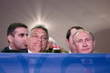 Vladimir Putin, Russia’s leader, and Viktor Orban, Hungary’s Prime Minister, sit during the judo world championships in Budapest, Hungary, on August 28, 2017. (Source: Getty Images)