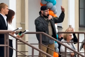 Alexander Klaus, who joined Russian forces in August 2023 and served as a machine gunner, speaks to the school children in Krasnoyarsk on September 1, 2026.
