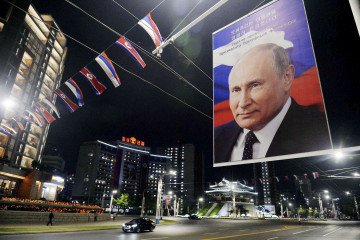 A big panel showing a picture of Russian leader Vladimir Putin is seen in Pyongyang on June 19, 2024, as North Korean leader Kim Jong Un holds talks with Putin in the capital the same day. (Source: Getty Images)