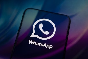 Russia to Shut Down WhatsApp in 2026 Over Meta’s “Extremist” Designation The WhatsApp logo appears on a smartphone reflecting an abstract illustration in blue and purple colors. Illustrative image. (Photo: Samuel Boivin/NurPhoto via Getty Images)