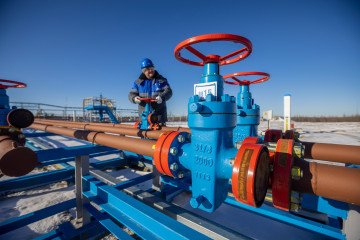 A worker turns a valve wheel at a gas well on the Gazprom PJSC Chayandinskoye oil, gas and condensate field on October 12, 2021. A worker turns a valve wheel at a gas well on the Gazprom PJSC Chayandinskoye oil, gas and condensate field on October 12, 2021.