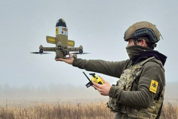 Ukrainian serviceman prepares a STING interceptor drone designed to counter Russian Shahed-type UAVs. (Source: Wild Hornets)