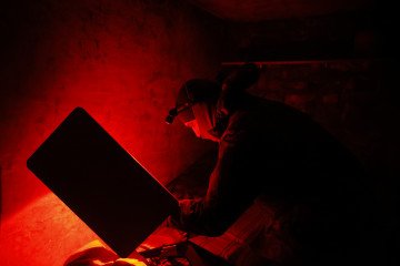 Ukrainian soldier adjusts a Starlink satellite modem for uninterrupted communication during a combat mission on March 12, 2025, in the Donetsk region, Ukraine. Ukrainian soldier adjusts a Starlink satellite modem for uninterrupted communication during a combat mission on March 12, 2025, in the Donetsk region, Ukraine.