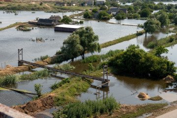 A photograph taken on June 9, 2023 shows an area flooded by rising water levels following damage sustained to the Kakhovka hydroelectric power plant dam in Chornobaivka, Kherson region. (Source: Getty Images)