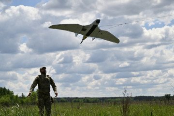 A serviceman of the State Border Guard Service of Ukraine launches an UAV for a patrol flight along the Ukraine-Belarus border in Chernigiv region on June 1, 2026. (Source: Getty Images)
