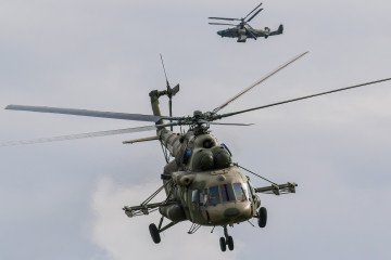 A Russian Air Force Mil Mi-8 and Kamov Ka-52 "Alligator" attack helicopter fly during the annual Army Games defense technology international exhibition in Russia. Illustrative photo. (Source: Getty Images)
