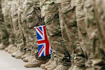 A British flag among soldiers. Illustrative image. (Source: Getty Images)