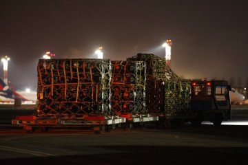 An airport vehicle pulls a portion of a shipment of weapons that includes Javelin anti-tank missiles delivered by the United States military at Boryspil Airport near Kyiv on January 25, 2022, in Boryspil, Ukraine.