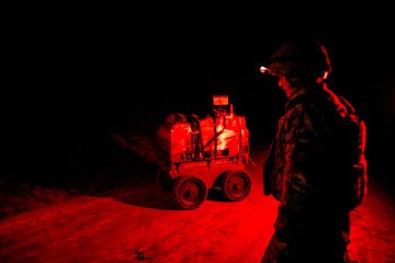 A serviceman of the unmanned and ground robotic systems unit of the 225th Separate Assault Regiment stands near a ground robotic system loaded with supplies for troops at positions, Ukraine, on March 10, 2026(Source: Getty Images) A serviceman of the unmanned and ground robotic systems unit of the 225th Separate Assault Regiment stands near a ground robotic system loaded with supplies for troops at positions, Ukraine, on March 10, 2026(Source: Getty Images)