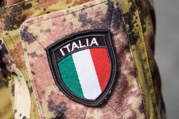 Italy Rejects PURL Funding for Ukraine While Redefining Own Defense Budget A badge is seen on the arm of a soldier at the Vatican in Rome, Italy. (Source: Getty Images)