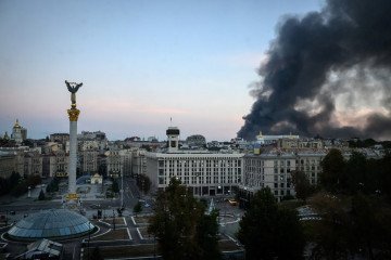 Smoke rising over buildings following Russian air attacks in downtown Kyiv on September 8, 2026.