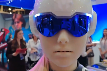 A close-up of a humanoid robot wearing a white helmet and blue visor at the St. Petersburg International Economic Forum. (Source: Russian media)