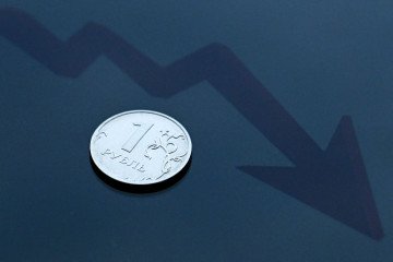 This photograph taken on July 6, 2022 shows a Russian ruble coin in Moscow. (Source: Getty Images)