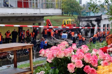 A flower-filled tray stands near the Chernihivska Metro Station, damaged by a Russian strike on October 19, 2026, in Kyiv, Ukraine. (Source: Getty Images)