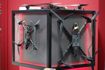 Various FPV-strike drones hang on display at the Ukrainian company General Cherry stand at the XPONENTIAL Europe autonomous systems and robotics trade fair on March 26, 2026 in Dusseldorf, Germany. (Source: Getty Images)