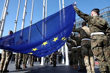 Eurocorps soldiers carry a European Union flag during the commemoration of the 80th anniversary of the end of World War II in Europe in Strasbourg, eastern France on May 7, 2025. (Source: Getty Images)