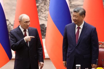 Russian leader Vladimir Putin points to Chinese President Xi Jinping during the signing ceremony on May 20, 2026, in Beijing, China.