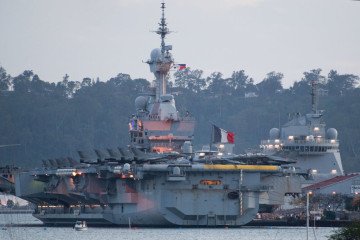 The French aircraft carrier Charles de Gaulle is seen at the former US naval base in Subic Bay, Zambales province, north of Manila on February 23, 2025. (Source: Getty Images)