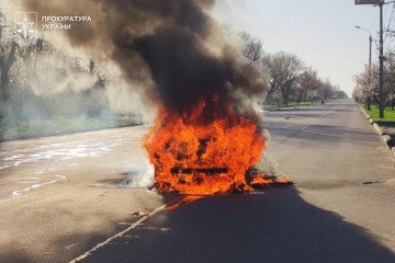 Russian Strikes on Nikopol Injure Nine, Including Two Children A car engulfed in flames in the middle of a street after a Russian attack on Nikopol district. (Source: Ukrainian Prosecutor’s Office)