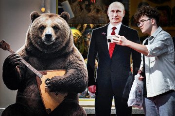 A man takes a selfie with a cardboard cutout of Russian leader Vladimir Putin on the tourist Arbat Street in downtown Moscow on August 24, 2026.