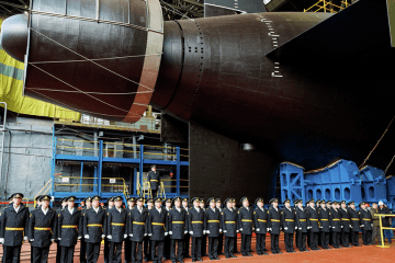 Russian naval officers stand in front of the *Khabarovsk* nuclear submarine during its launch ceremony at the Sevmash shipyard in Severodvinsk, near the Finnish border. (Source: Russian Ministry of Defense)