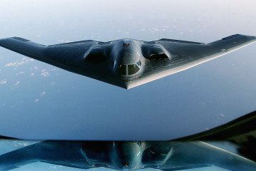 A US B-2 Spirit stealth bomber flies over the Indian Ocean after completing a mission during the Iraq War, March 27, 2003. (Source: Getty Images)
