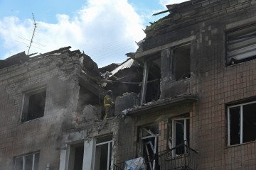 Russian FPV Drone Kills Last Remaining Resident of Border Village in Kharkiv Region Rescuers search the rubbles of a damaged residential building following a Russian missile strike in Kharkiv on July 8, 2026. (Source: Getty Images)