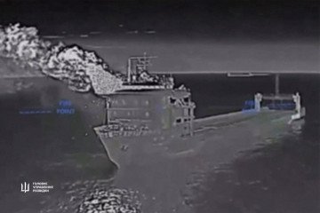 Thermal imaging captures fire and smoke rising from the Russian rail ferry Slavyanin after a Ukrainian drone strike. (Source: HUR)