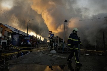Firefighters work to extinguish a fire at a book market in Kyiv, Ukraine, on August 16, 2026. (Source: Getty Images)
