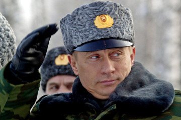 Russian leader Vladimir Putin salutes officers on 18 February, 2004, shortly after his arrival at the observation point of the Arctic cosmodrome in Plesetsk. (