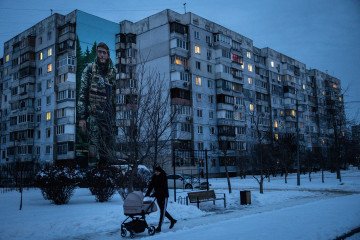 United Kingdom Allocates $27 Million for Ukraine’s Energy Repairs in New Aid Package A man walks past a building suffering from limited electricity and painted with the mural of a fallen Ukrainian soldier on February 18, 2026 in Kyiv, Ukraine. (Source: Getty Images)