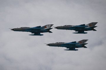 Three MIG-21 LanceR fly in formation on their last flight, during ceremonies organized by the Romanian Minister of Defense at "Air Base 86 Borcea" in Borcea, Romania on May 15, 2023. Romania on May 15, 2023. Illustrative photo. (Source: Getty Images)
