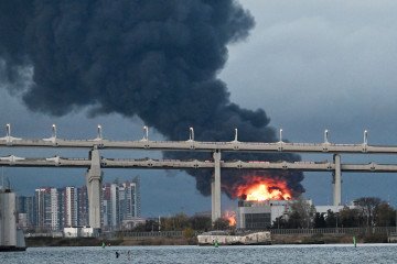 Smoke rises over St. Petersburg following a drone strike on an oil terminal on October 18, 2026. (Source: Getty Images)